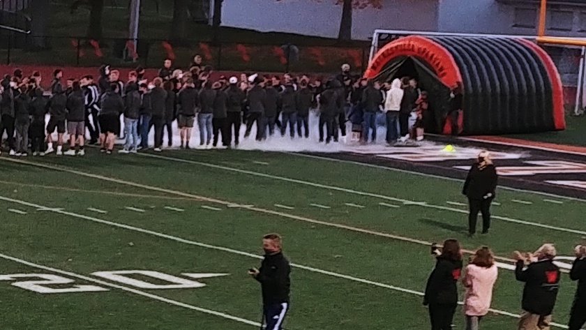 tunnel with smoke on a football field